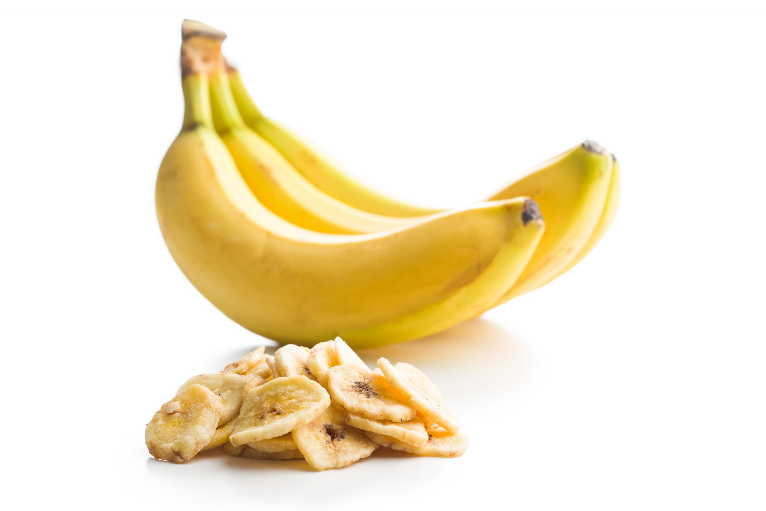 Dried banana chips isolated on white background.